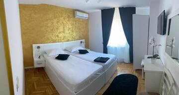Фото номера Двухместный номер с 2 отдельными кроватями Гостевой дом Casa Cattleya г. Тыргу-Жиу 9