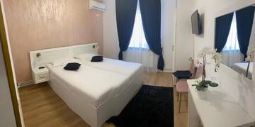 Фото номера Двухместный номер с 1 кроватью Гостевой дом Casa Cattleya г. Тыргу-Жиу 5